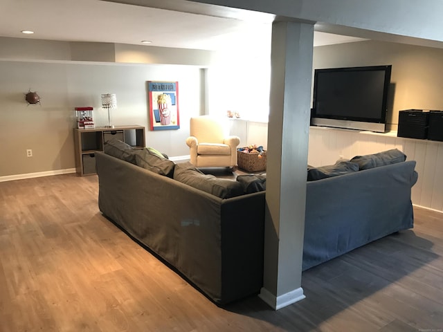 living room with baseboards and wood finished floors