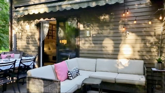 view of patio / terrace with outdoor dining space and an outdoor living space