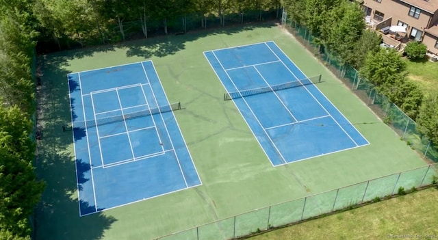 view of tennis court with fence