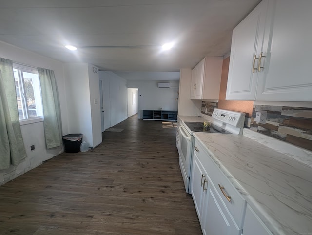 kitchen featuring light stone countertops, decorative backsplash, dark wood-type flooring, white cabinets, and white electric range