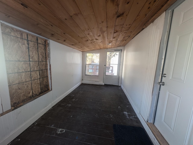 unfurnished sunroom with wood ceiling