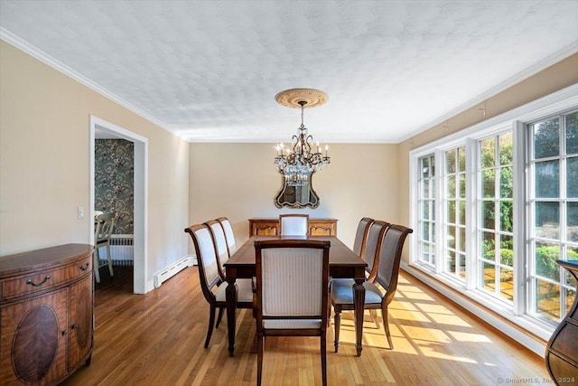 dining room with radiator, a baseboard heating unit, a chandelier, ornamental molding, and light wood-style floors