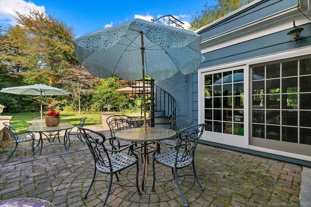 view of patio / terrace with stairs and outdoor dining area