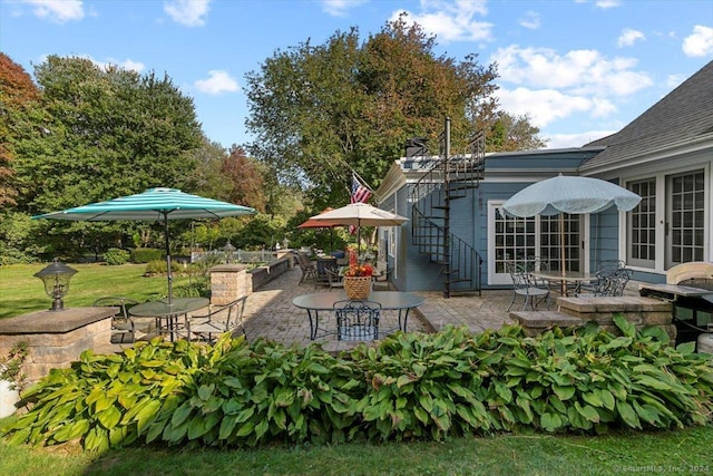 view of patio / terrace featuring stairs and french doors