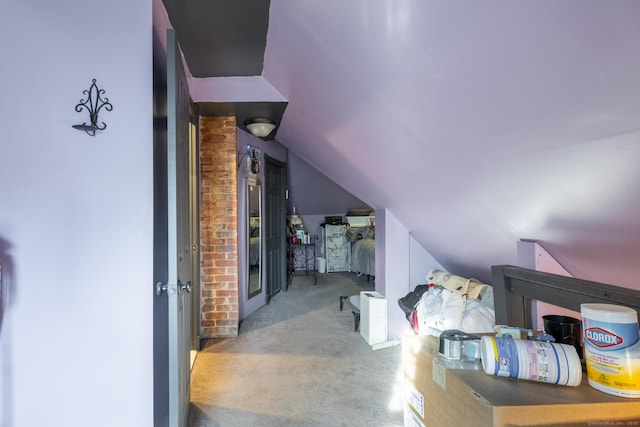 bonus room featuring lofted ceiling and carpet floors