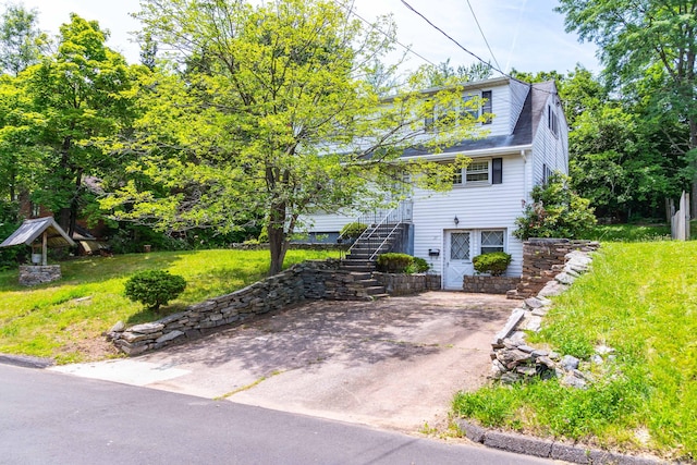 27 Mountain View Dr, East Hartford, CT 06117 - view of front facade featuring stairway and a front lawn