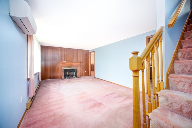27 Mountain View Dr, East Hartford, CT 06117 - unfurnished living room with a wall mounted AC, light carpet, stairway, a fireplace, and wooden walls