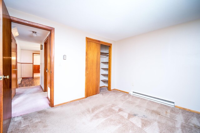 27 Mountain View Dr, East Hartford, CT 06117 - unfurnished bedroom featuring a baseboard heating unit, carpet, and a closet
