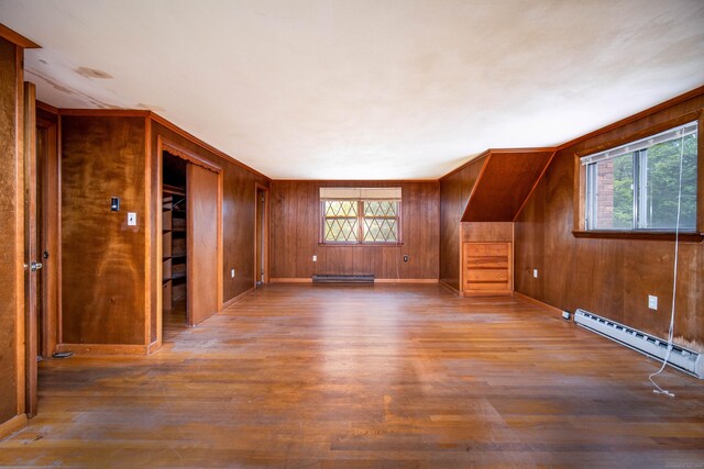 27 Mountain View Dr, East Hartford, CT 06117 - bonus room featuring a baseboard radiator, wood finished floors, baseboard heating, and wooden walls