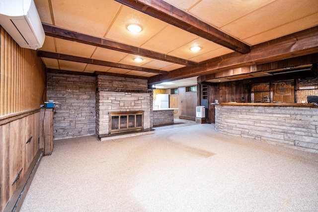 27 Mountain View Dr, East Hartford, CT 06117 - unfurnished living room featuring a wall unit AC, wood walls, carpet floors, a stone fireplace, and beamed ceiling