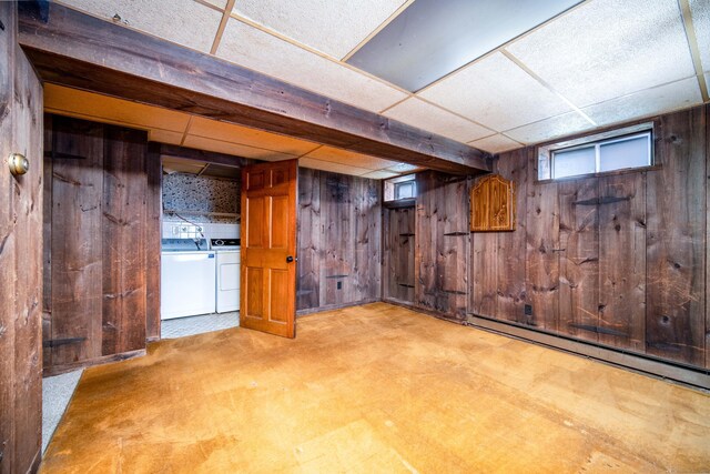 27 Mountain View Dr, East Hartford, CT 06117 - below grade area with wood walls, baseboard heating, separate washer and dryer, and a paneled ceiling
