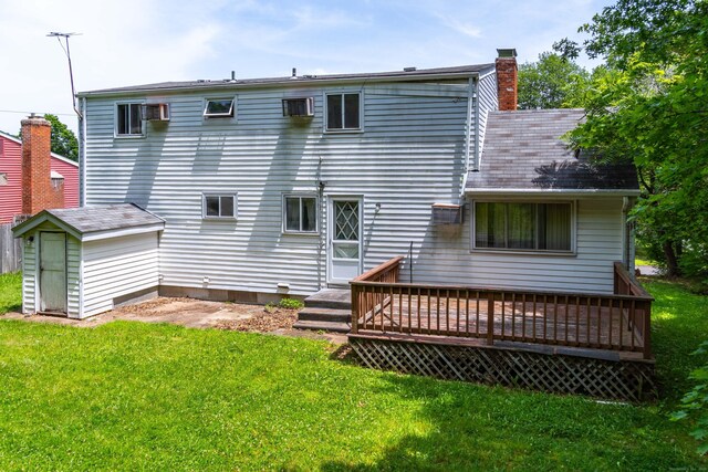27 Mountain View Dr, East Hartford, CT 06117 - back of house featuring a lawn, a wooden deck, a chimney, and a storage shed
