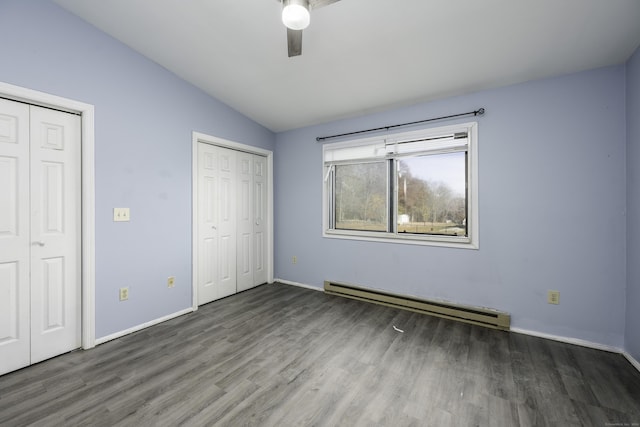 unfurnished bedroom featuring baseboards, vaulted ceiling, wood finished floors, a ceiling fan, and a baseboard radiator