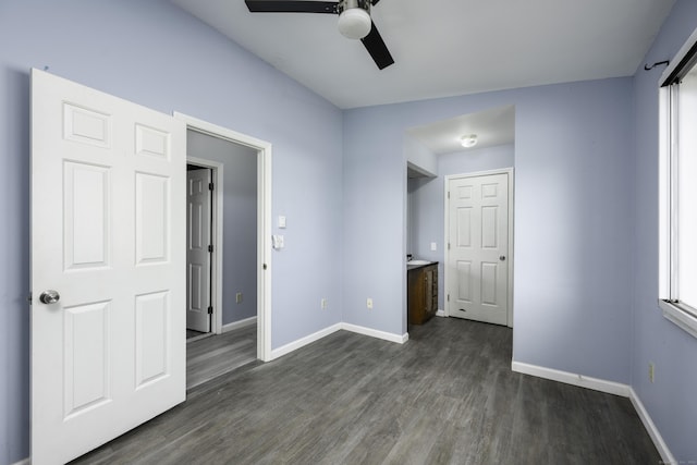 unfurnished bedroom featuring dark wood finished floors, ceiling fan, and baseboards