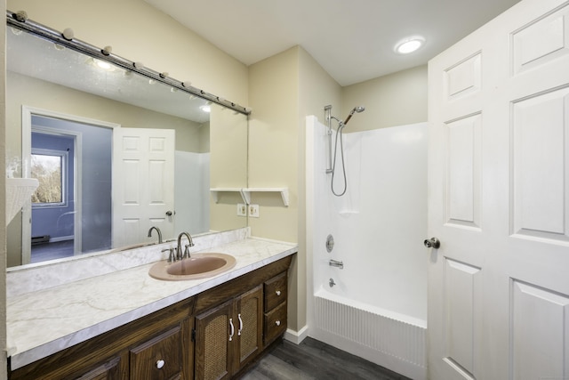 full bath with vanity, shower / bathing tub combination, and wood finished floors