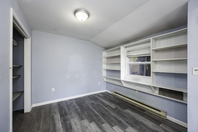 unfurnished bedroom with dark wood finished floors, baseboards, a baseboard heating unit, and lofted ceiling