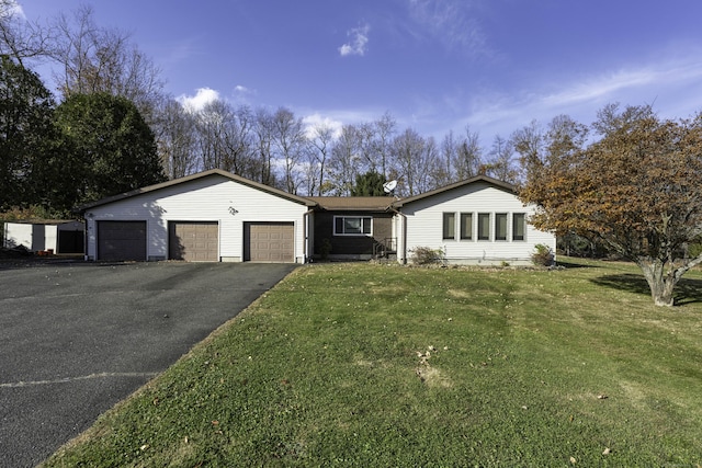 single story home with a front yard, a garage, and aphalt driveway