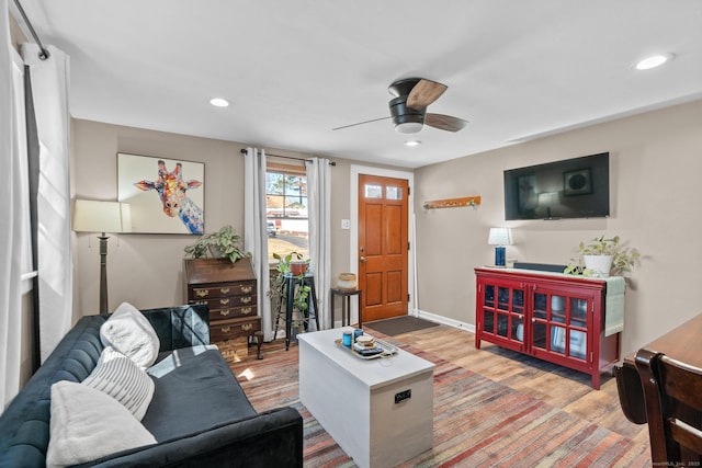 living room with recessed lighting, baseboards, wood finished floors, and a ceiling fan