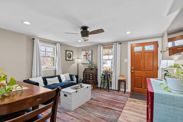 living room with recessed lighting, baseboards, light wood finished floors, and ceiling fan