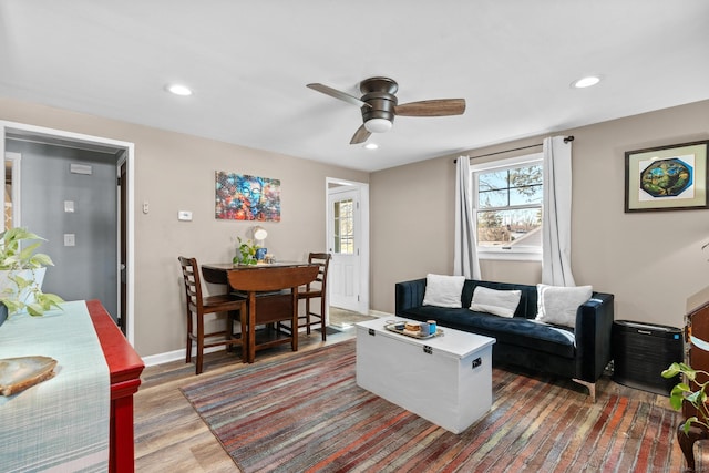 living area with recessed lighting, baseboards, wood finished floors, and ceiling fan