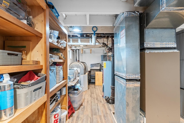 interior space with gas water heater and heating unit