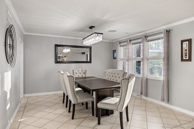 dining space featuring light tile patterned floors, crown molding, and baseboards