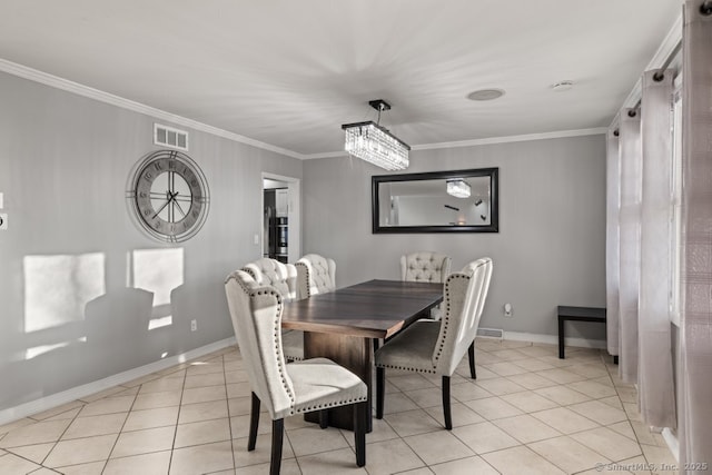 dining room with light tile patterned flooring, baseboards, visible vents, and ornamental molding