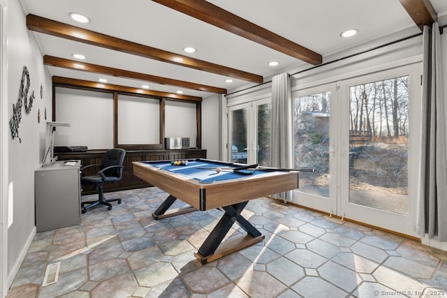 rec room featuring beam ceiling, recessed lighting, visible vents, and stone finish flooring