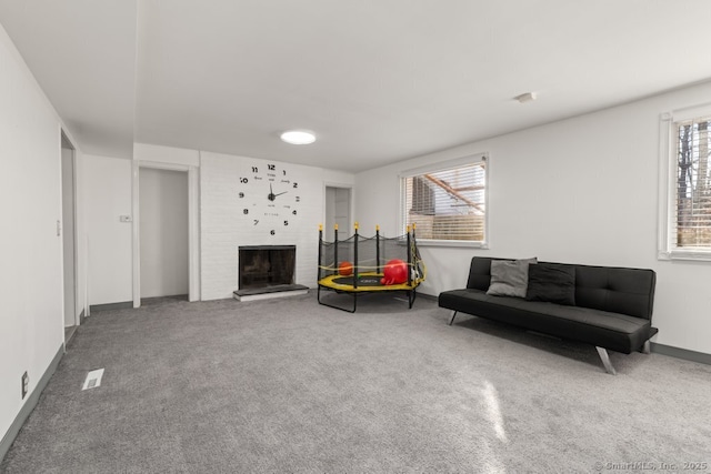 sitting room featuring carpet floors and a fireplace