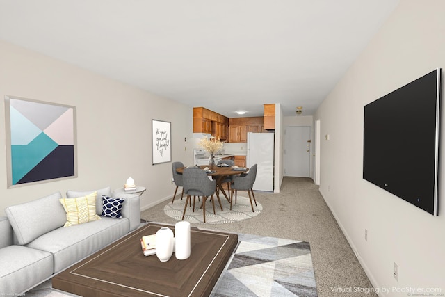 living area featuring baseboards and light carpet