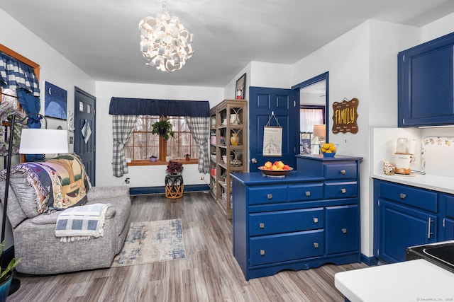 interior space with wood finished floors and a chandelier