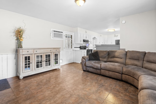 living room with a wall unit AC
