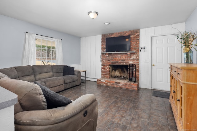 living room featuring a baseboard radiator and a fireplace