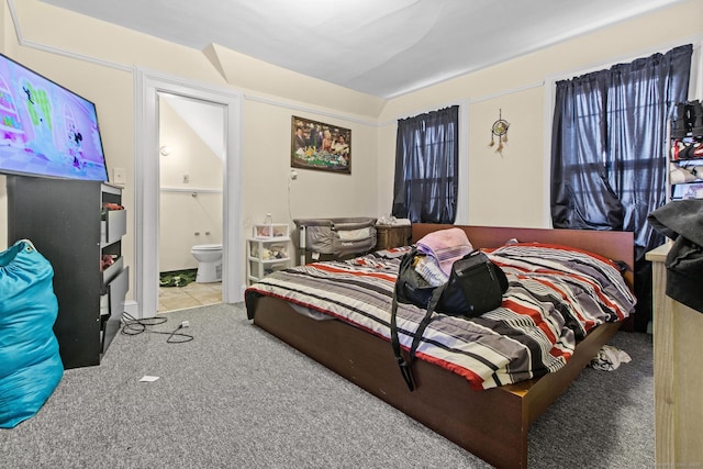 bedroom featuring carpet flooring and ensuite bathroom