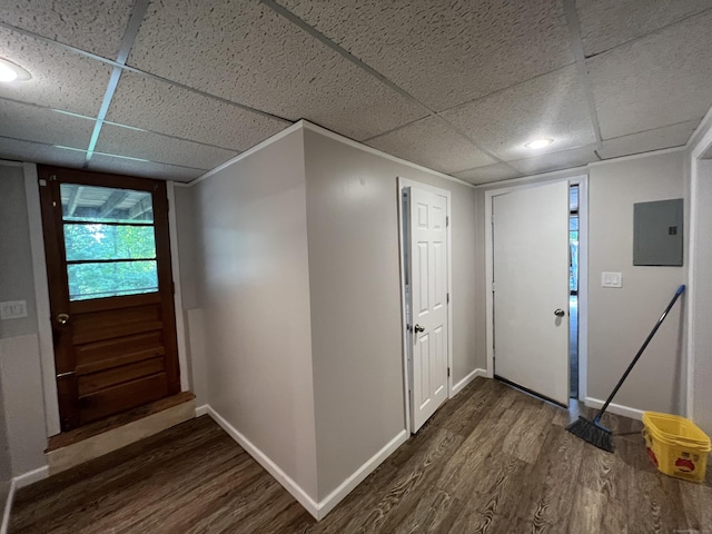 foyer with electric panel, baseboards, dark wood-style flooring, and a paneled ceiling