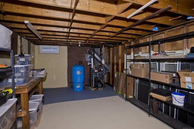 storage room featuring a heating unit