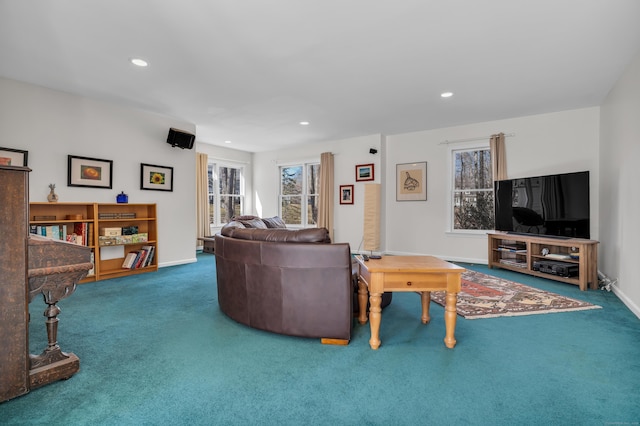 living room with recessed lighting, baseboards, and carpet