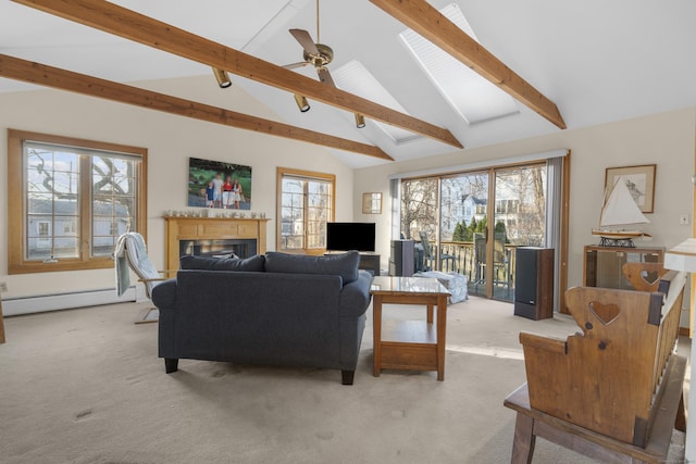 living area featuring a glass covered fireplace, light colored carpet, vaulted ceiling with beams, and a baseboard radiator