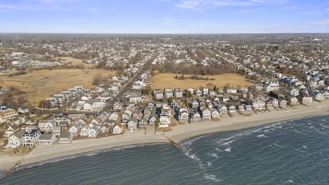 bird's eye view featuring a residential view, a view of the beach, and a water view