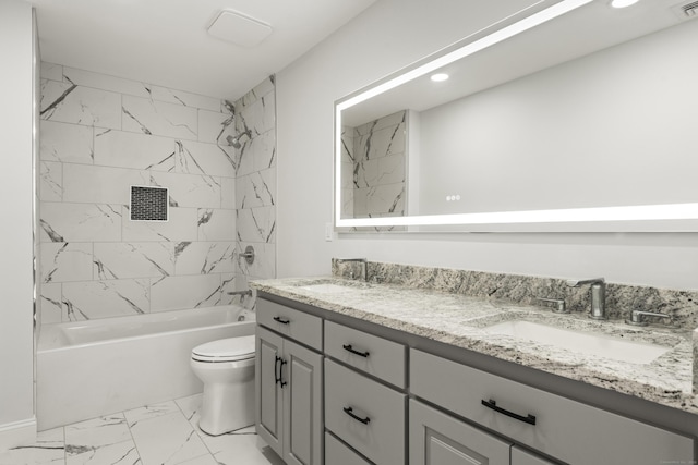 bathroom featuring a sink, toilet, marble finish floor, and shower / bathtub combination