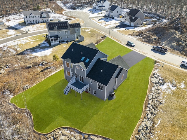 birds eye view of property with a residential view