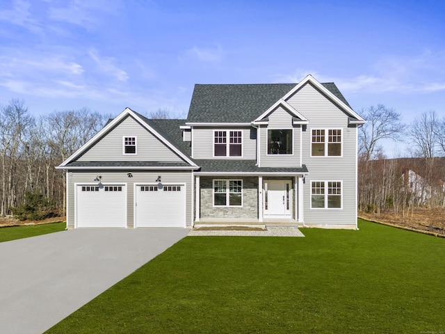 traditional home with stone siding, concrete driveway, a front yard, a shingled roof, and a garage