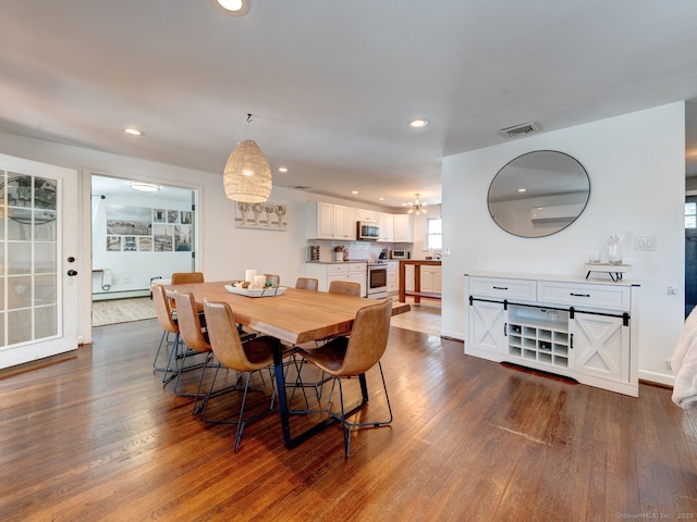 dining space with dark wood finished floors, visible vents, recessed lighting, and a baseboard radiator