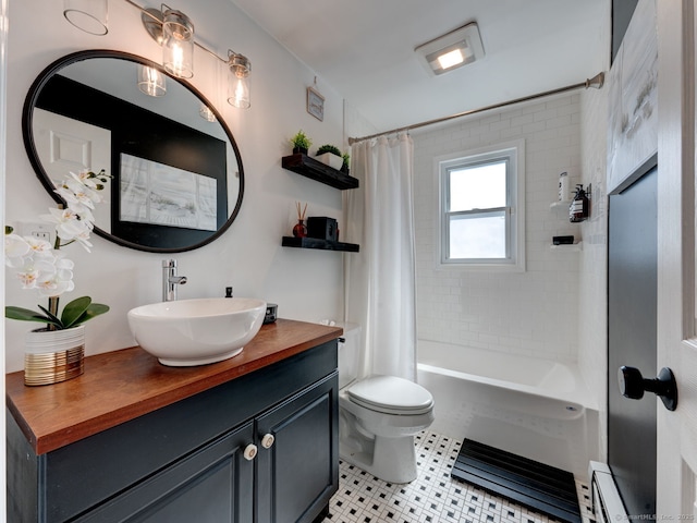 bathroom featuring a baseboard radiator, shower / bath combo with shower curtain, toilet, and vanity