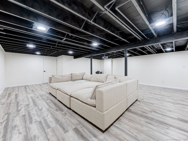 living area featuring wood finished floors and baseboards