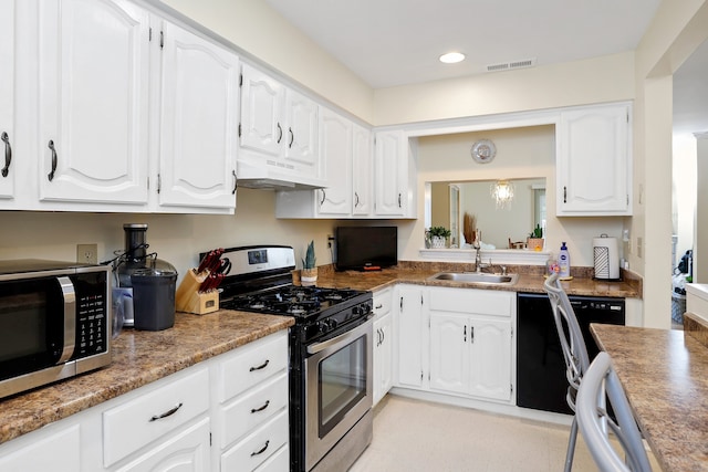 kitchen with visible vents, a sink, under cabinet range hood, stainless steel appliances, and white cabinets