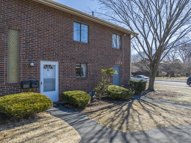 exterior space featuring brick siding