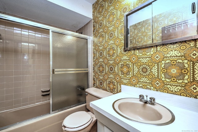 full bath featuring wallpapered walls, toilet, vanity, and enclosed tub / shower combo