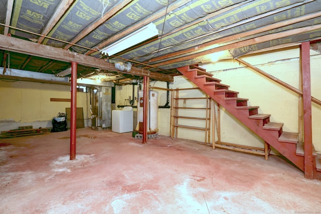 unfinished basement featuring water heater, heating unit, washer / dryer, and stairs