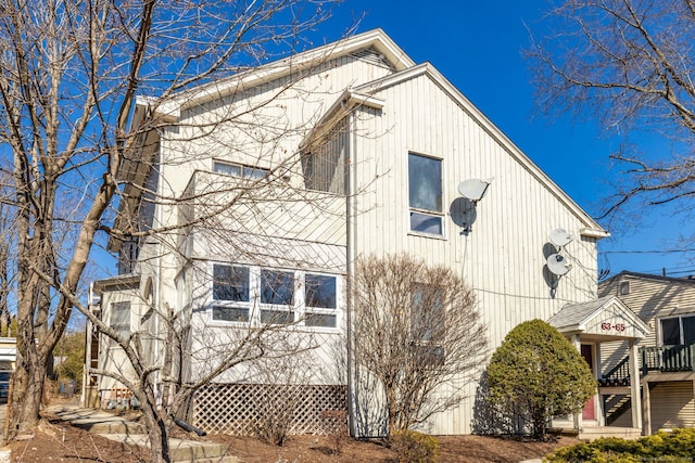 view of side of home with stairway